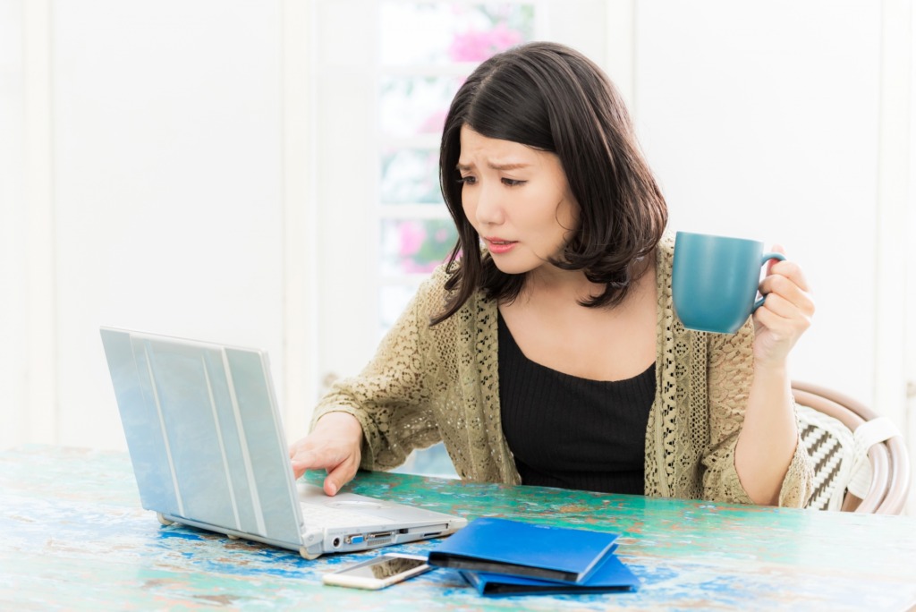 Woman operating a personal computer